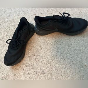 All black Nike shoes